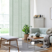 Living room with light green blinds, gray sofa, wooden coffee table, and plant.