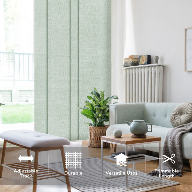 Living room with light green blinds, gray sofa, wooden coffee table, and plant.