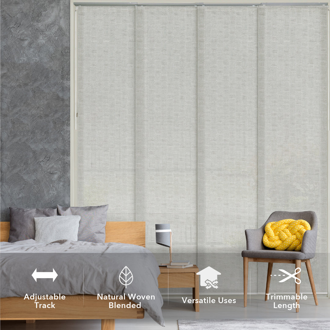 GoDear Design_Gray woven blinds in a bedroom setting with bed, chair, and nightstand.