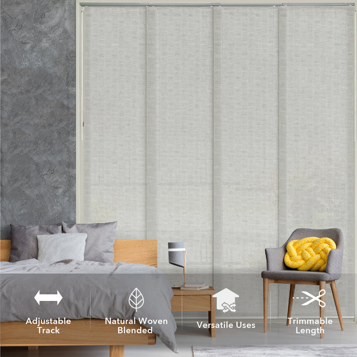 GoDear Design_Gray woven blinds in a bedroom setting with bed, chair, and nightstand.