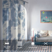 GoDear Living room with a patterned curtain, sofa, and artwork on a light gray wall.