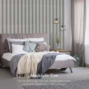 GoDear Bedroom with striped wallpaper, bed, and decor elements.