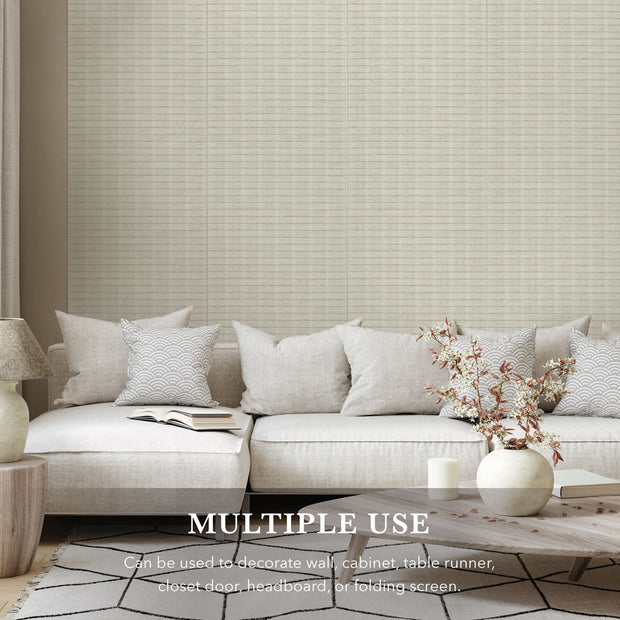 Light gray textured wall paper with a sofa and decor elements in a room setting.