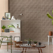 Room interior with a textured wall, shelves, and decor items.