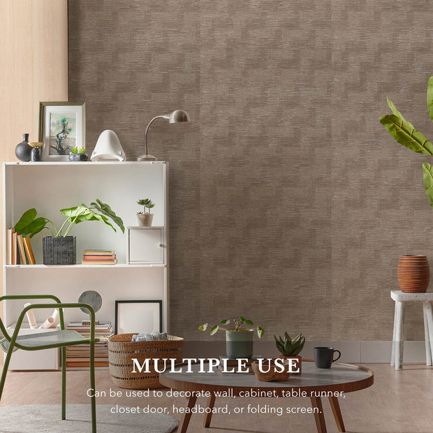 Room interior with a textured wall, shelves, and decor items.