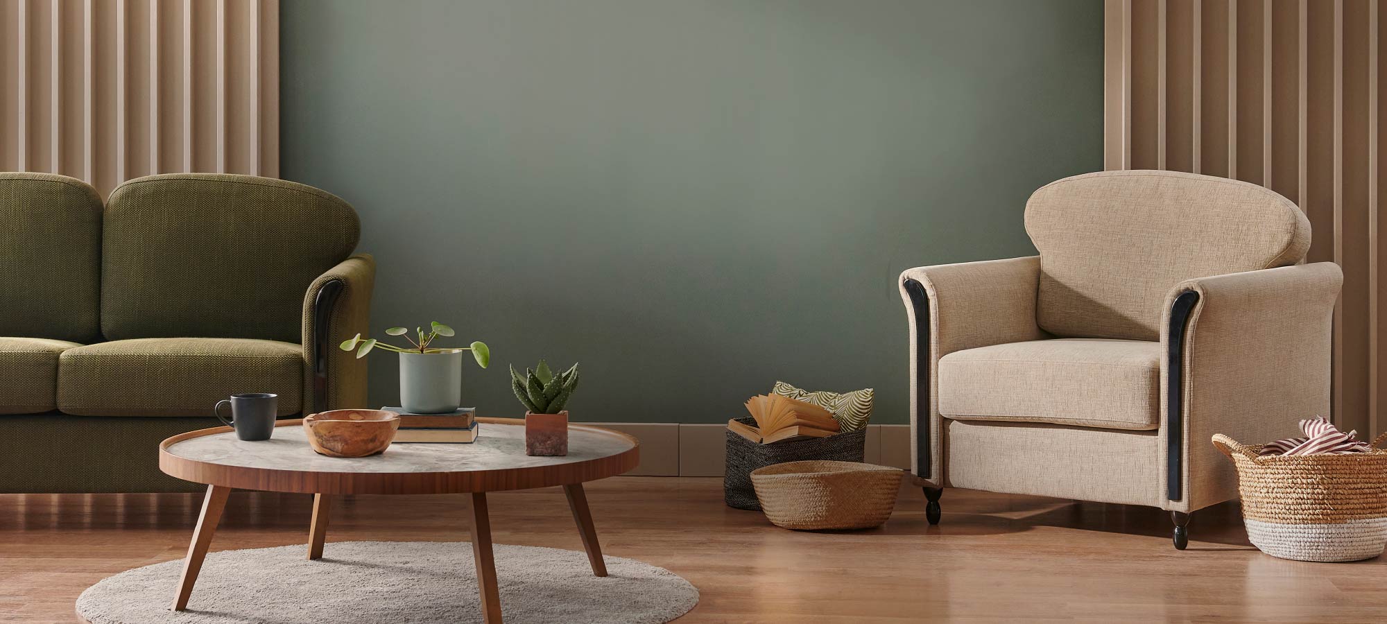Living room with a green sofa, beige armchair, and wooden coffee table.