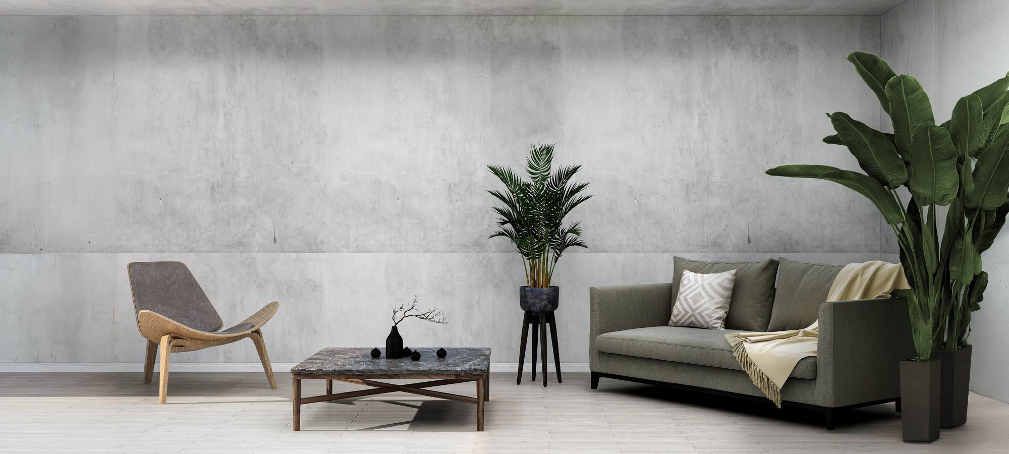 Modern living room with a gray sofa, wooden chair, and potted plants against a concrete wall.