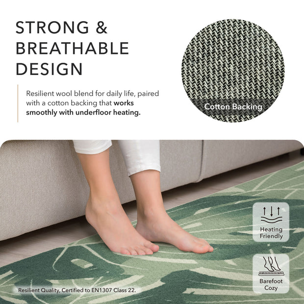 Green rug with a person standing on it, featuring text about its strong and breathable design and suitability for underfloor heating.
