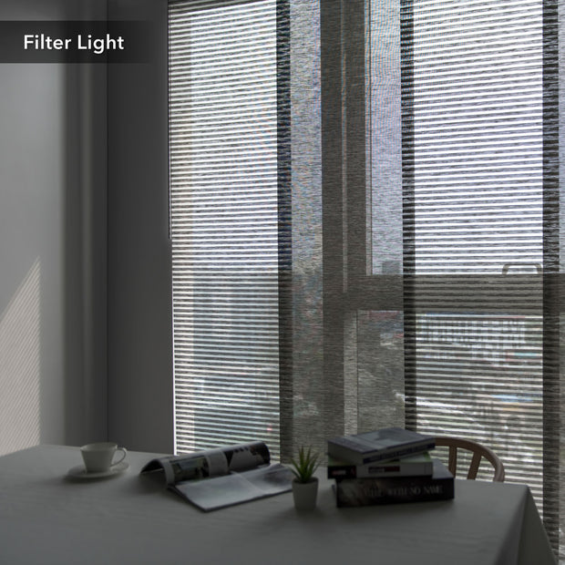GoDear Design Window blinds filtering light in a room with a table and decor items.