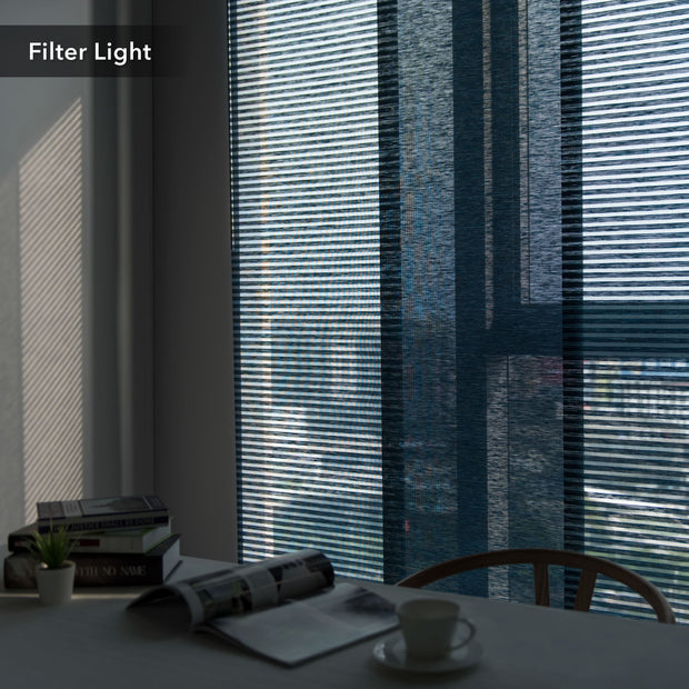GoDear Design Window with blinds filtering light, table with books and a cup in the foreground