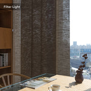 GoDear Room with a large window covered by a textured curtain, table with a cup and vase, and cityscape view.