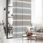 GoDear Design Living room with a striped room divider between a dining area and living area.