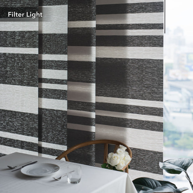 GoDear Design Table setting with flowers against a striped wall.