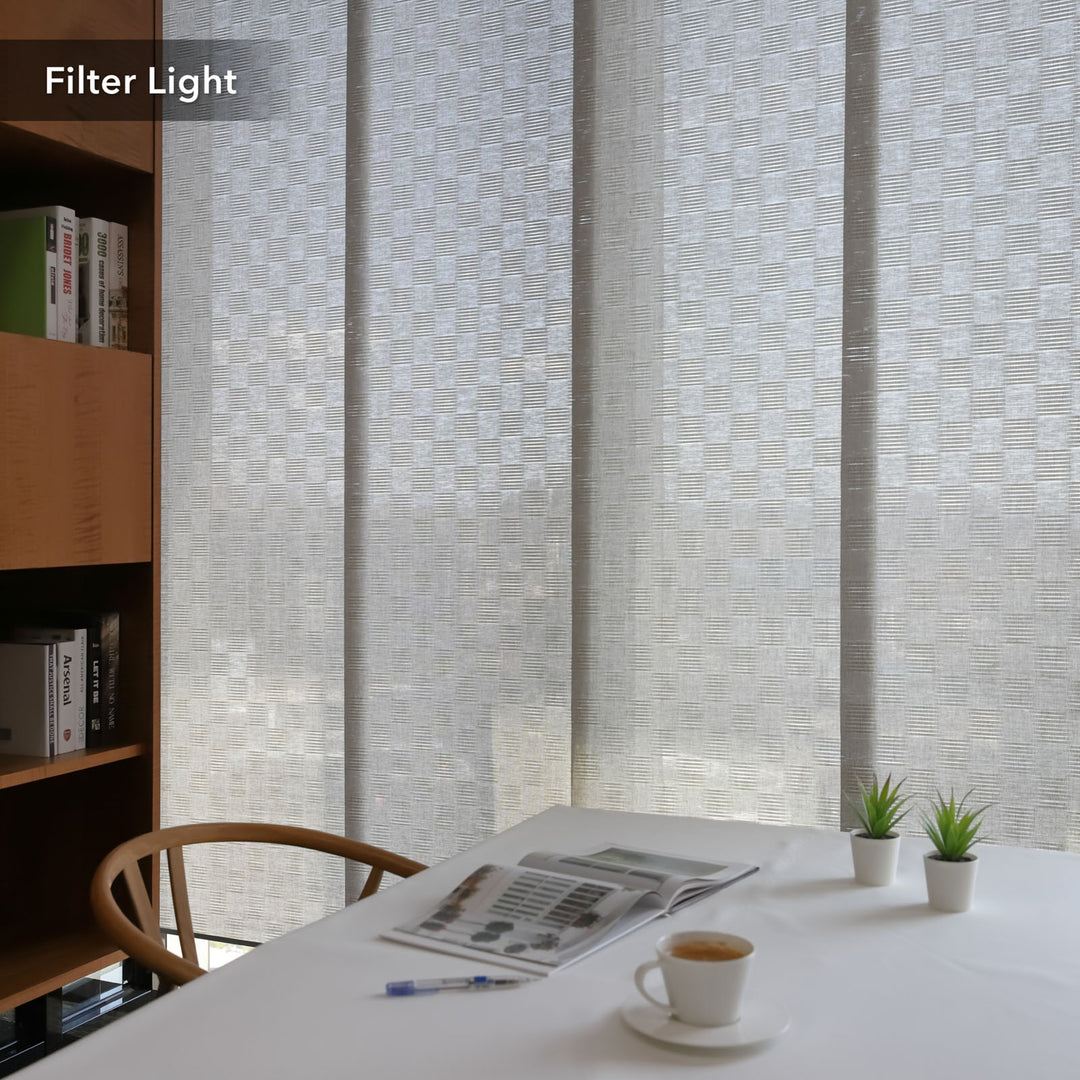 GoDear Design Room with a textured wall, table with newspaper and coffee, and bookshelf.