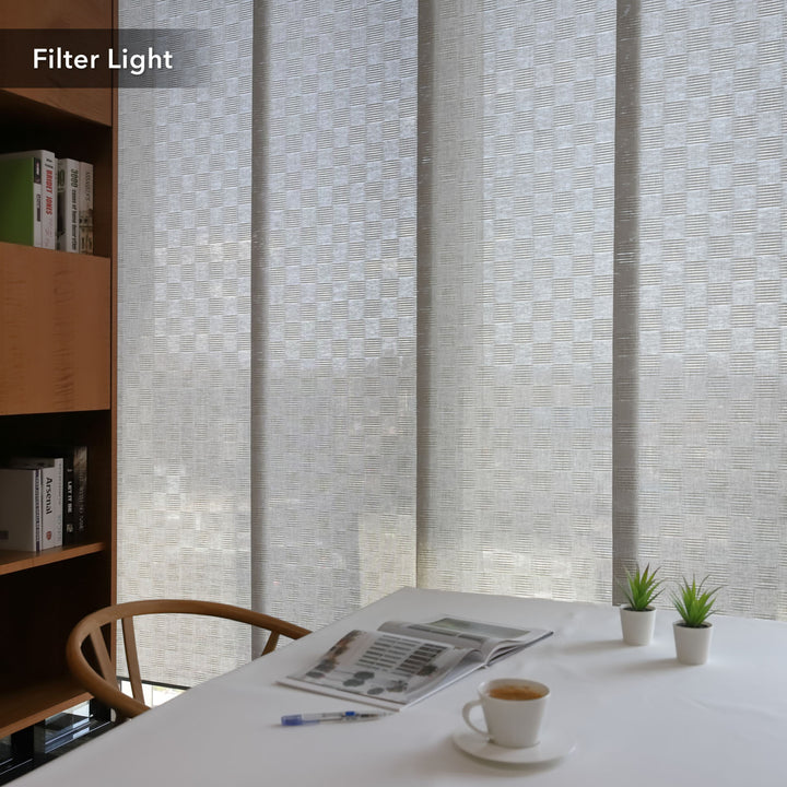 GoDear Design Room with a textured wall, table with newspaper and coffee, and bookshelf.