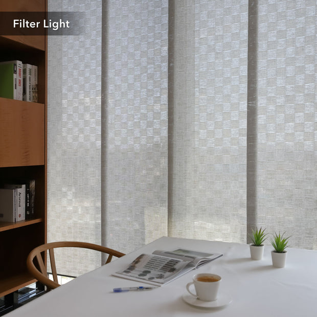 GoDear Design Room with a textured wall, table with newspaper and coffee, and bookshelf.