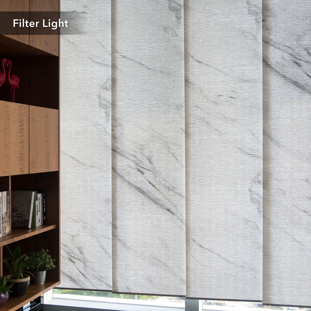 GoDear Design Marble-patterned window blinds filtering light in a room with a bookshelf and plants.