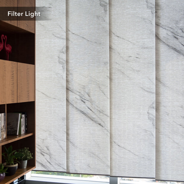 GoDear Design Marble-patterned window blinds filtering light in a room with a bookshelf and plants.
