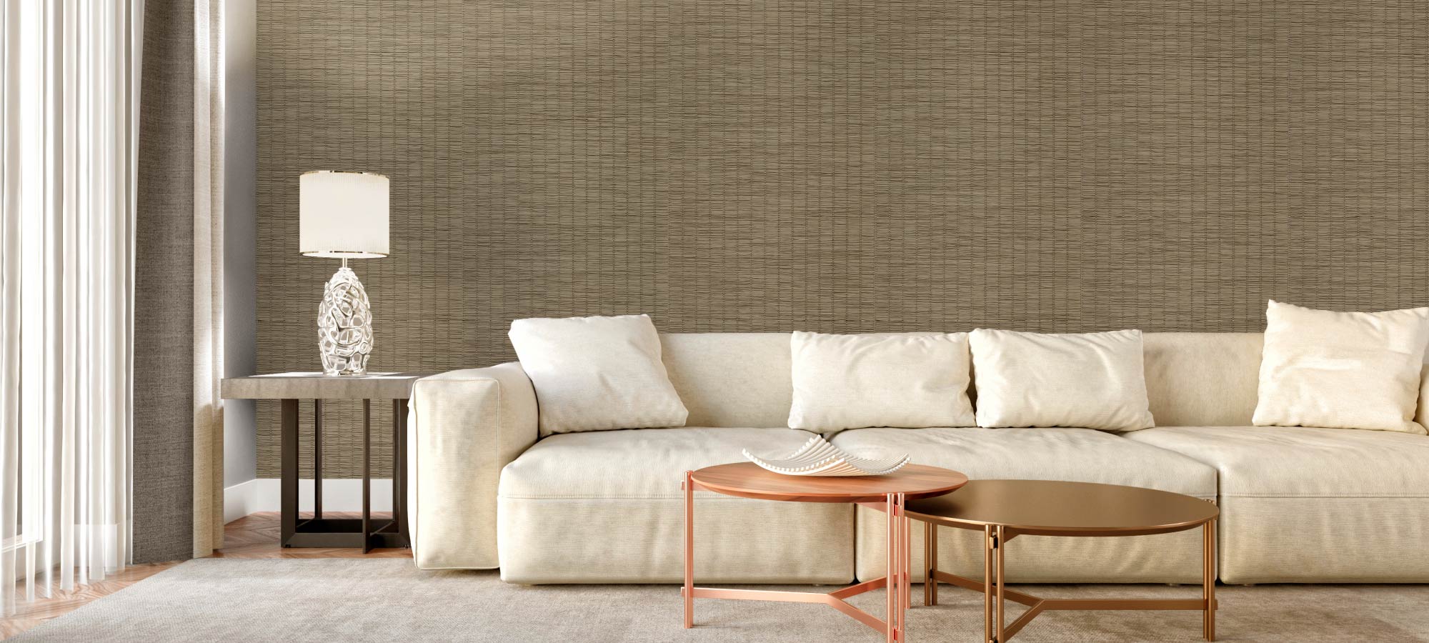 Modern living room with woven textured accent wall, cream sofa, metallic round coffee tables, and decorative table lamp.