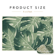 Green leaf-patterned rug with product size label and wool blend information.