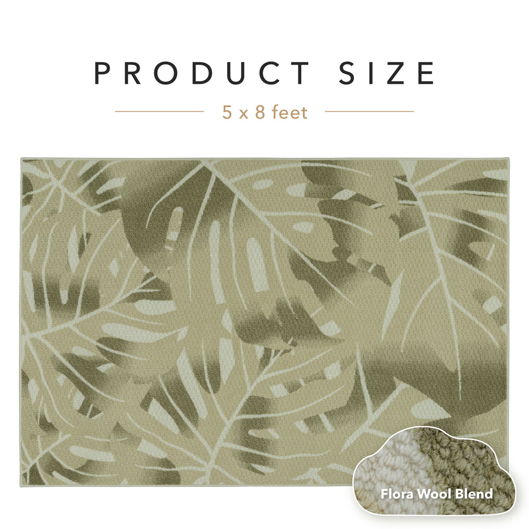 Textile with leaf pattern and product size information on a white background