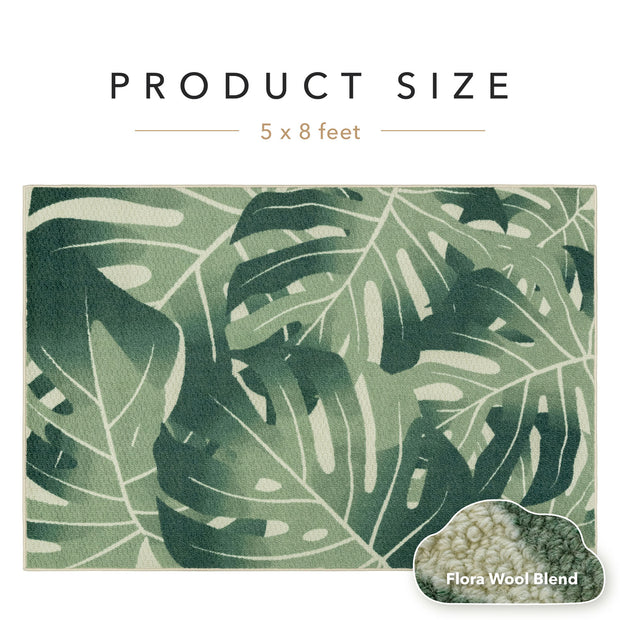 Green leaf-patterned rug with product size label and wool blend information.