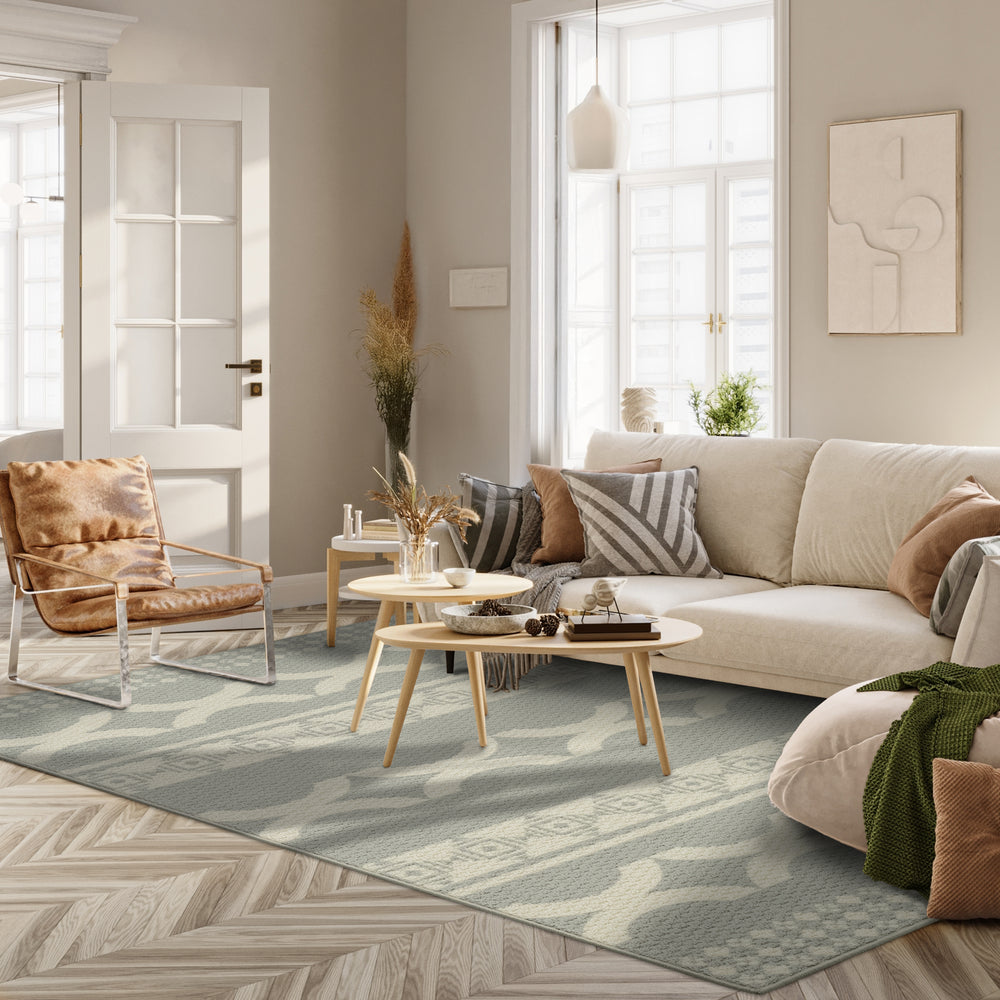 GoDear Design Modern living room with a beige sectional sofa, armchair, and coffee table.