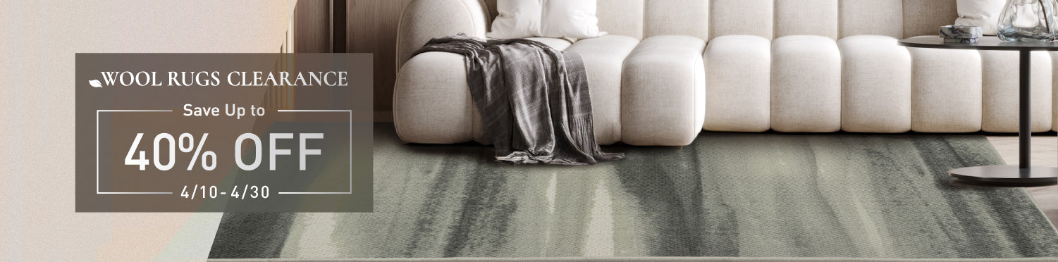 GoDear_Design_Wool rugs clearance sale with a white sofa and rug on a gray floor.