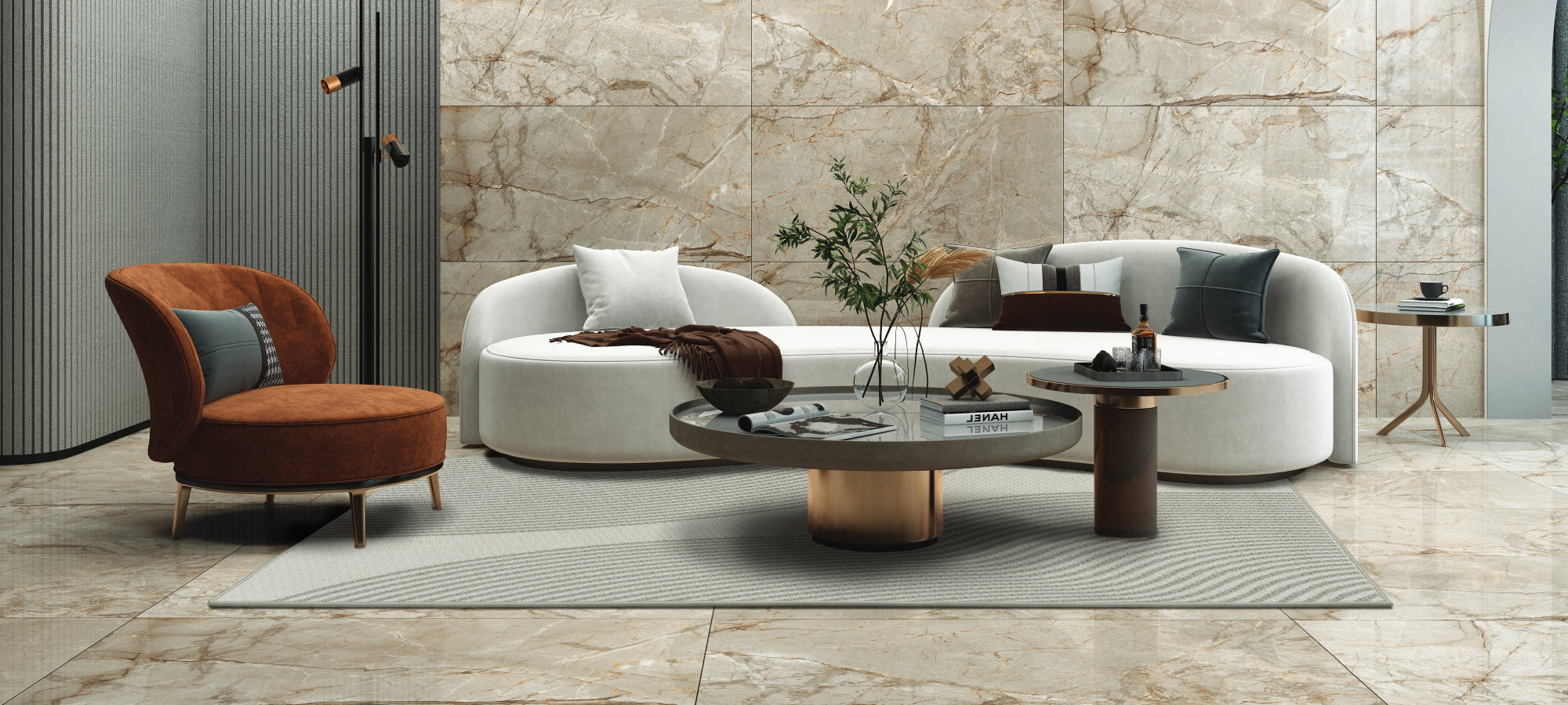 Modern living room with a white sofa, brown armchair, and round coffee table.