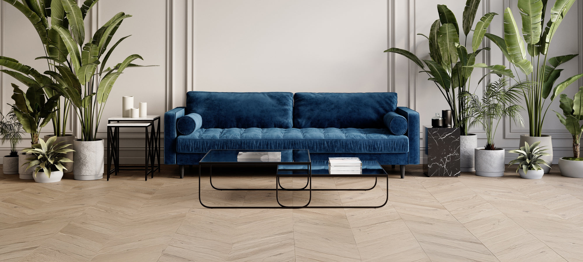 Room with blue sofa, glass coffee table, and greenery, pictured prior to the placement of the Indigenous rug, highlighting the untreated flooring and unsoftened acoustics.