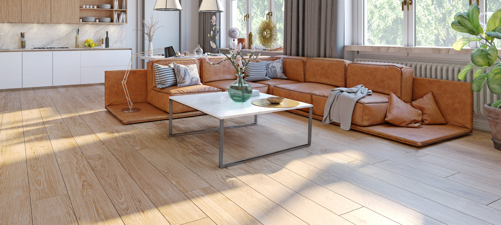 Room featuring an orange-brown sofa, metal coffee table, and wooden floor, pictured before installing area rugs, highlighting the original bright and airy space.