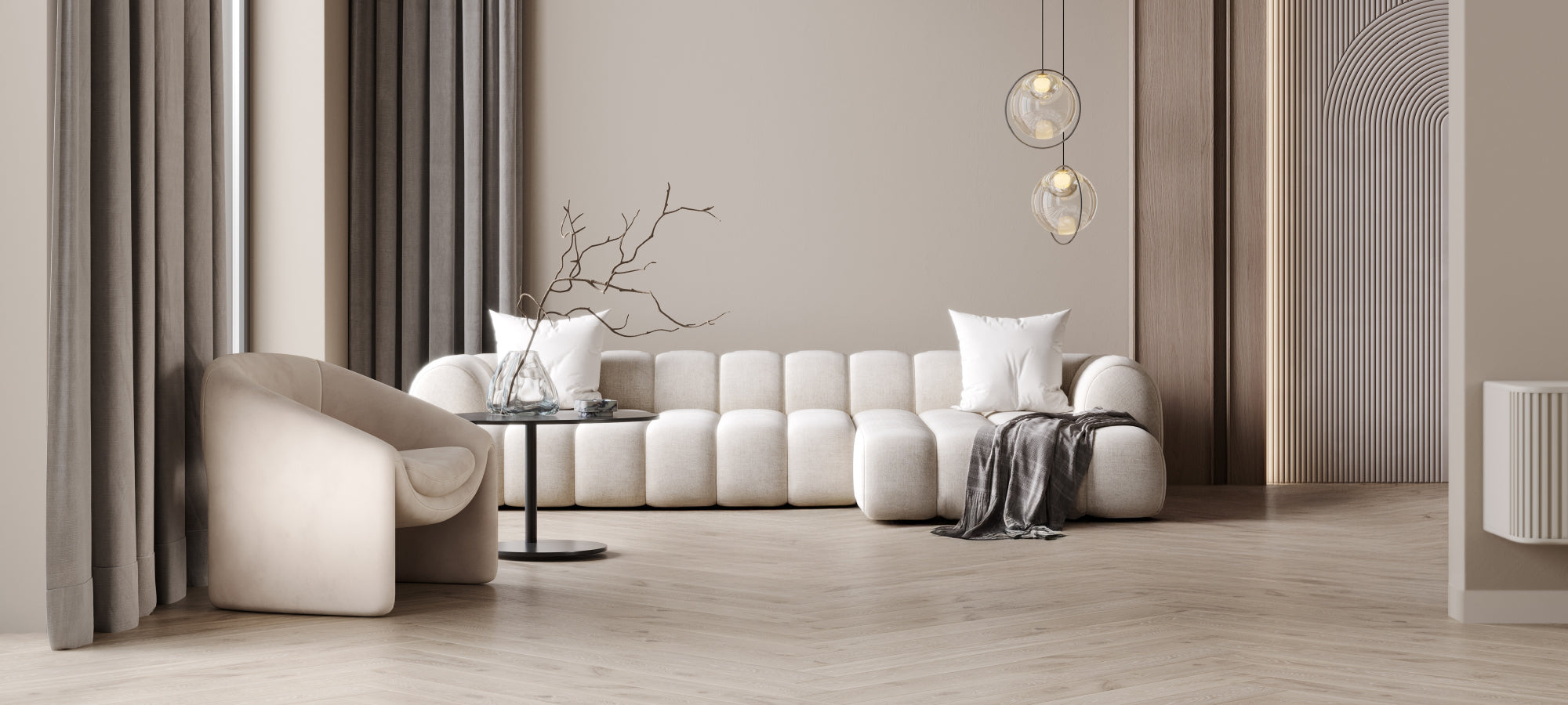 Modern living room with a white sofa, armchair, and decorative elements.