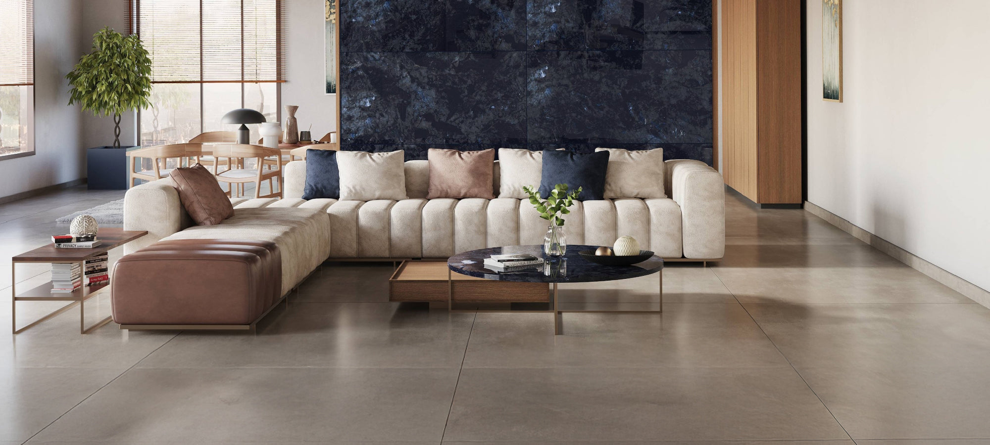 Modern living room with a sectional sofa, coffee table, and decorative items.