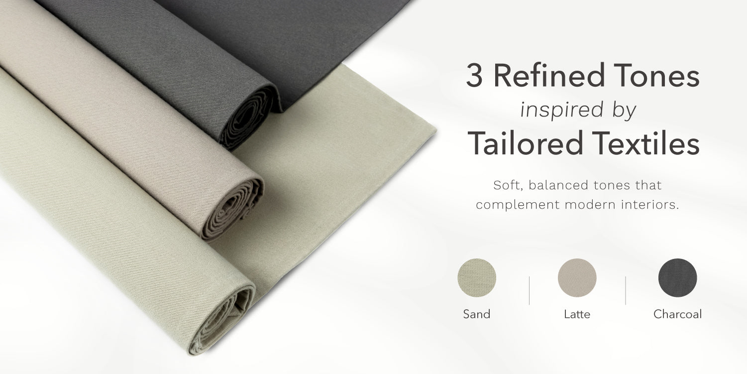 GoDear Design Three rolls of fabric in sand, latte, and charcoal on a white background with text about refined tones inspired by tailored textiles.