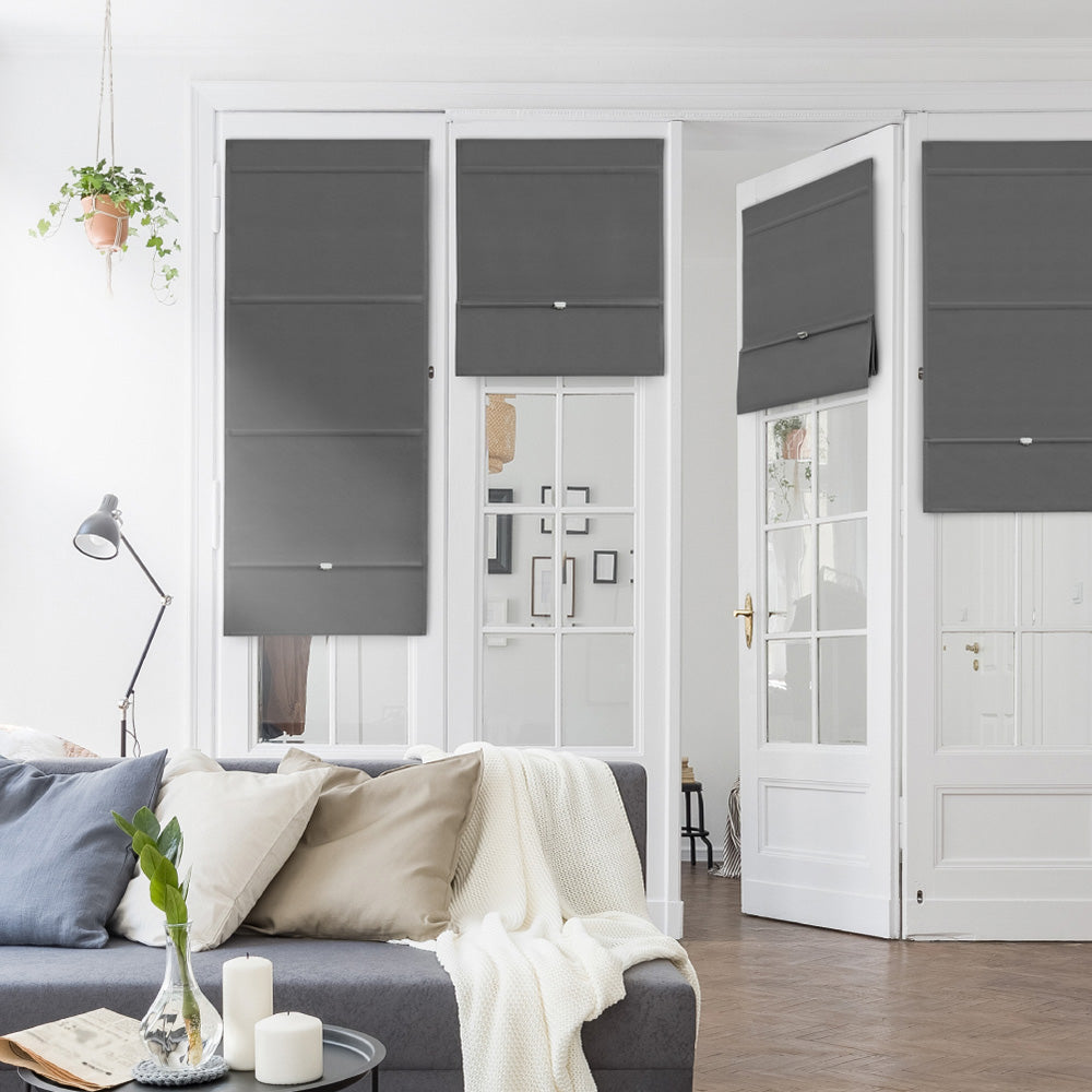 GoDear Design Living room with gray sofa, decorative pillows, and a plant.